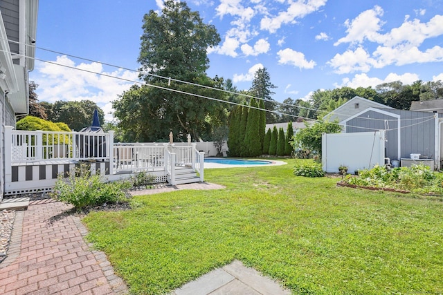 view of yard featuring a pool side deck