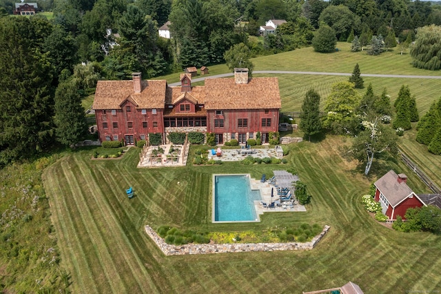 birds eye view of property featuring a rural view