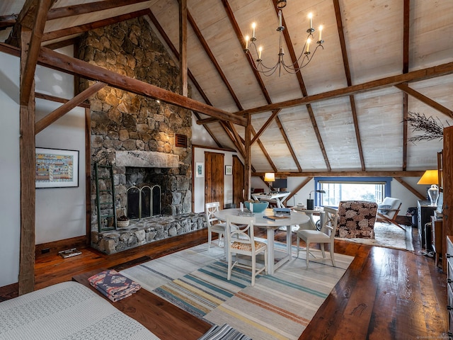 living room featuring an inviting chandelier, a fireplace, hardwood / wood-style flooring, wooden ceiling, and beam ceiling