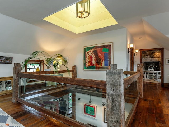 interior space with lofted ceiling and dark wood-type flooring