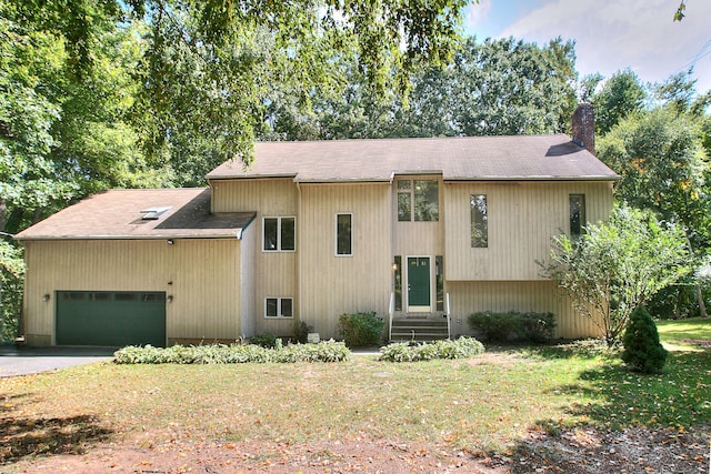 bi-level home with a front yard