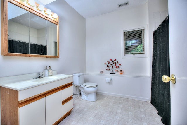 bathroom with vanity, toilet, and a shower with shower curtain