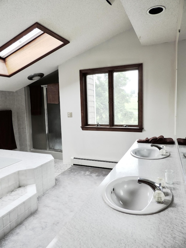 181 Scotland Rd, Sprague, CT 06330 - full bath with baseboard heating, a textured ceiling, double vanity, a garden tub, and a stall shower
