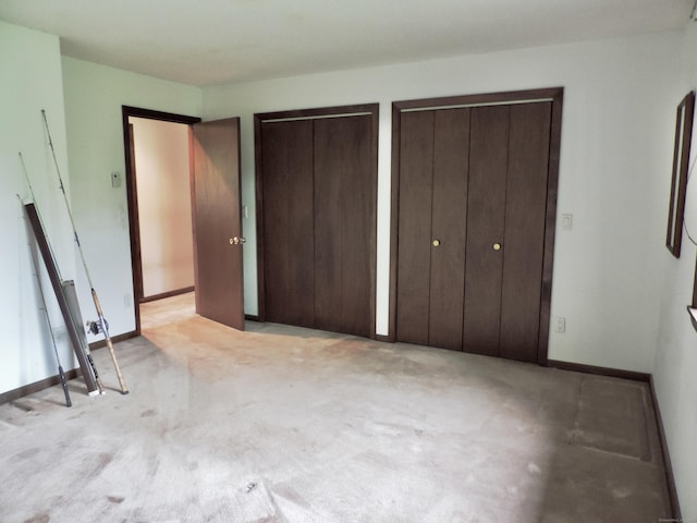 181 Scotland Rd, Sprague, CT 06330 - unfurnished bedroom featuring two closets and light colored carpet
