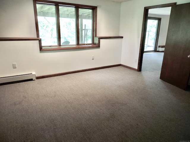 181 Scotland Rd, Sprague, CT 06330 - unfurnished room with healthy amount of natural light, carpet, and a baseboard heating unit