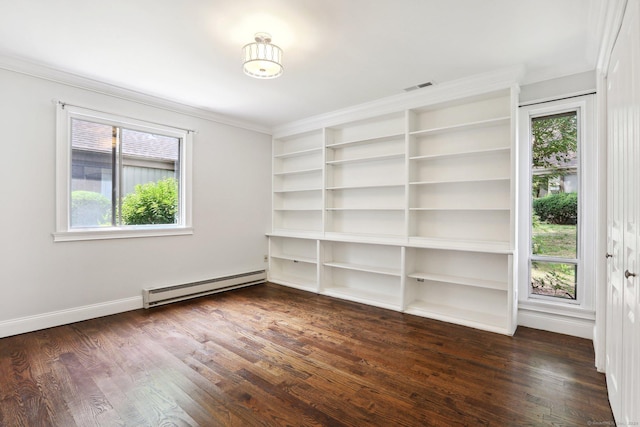 empty room with a baseboard heating unit, ornamental molding, and dark hardwood / wood-style floors