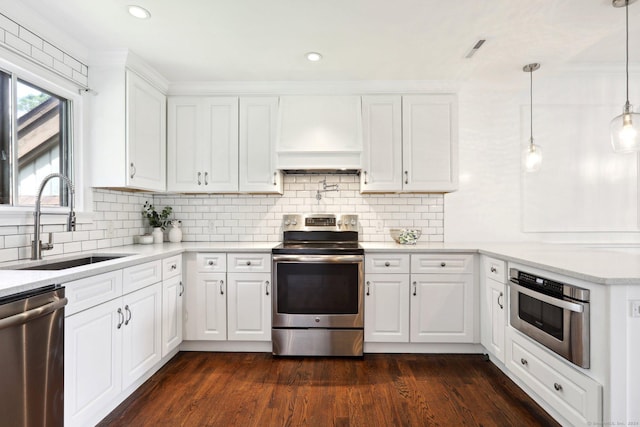 kitchen with sink, white cabinets, and appliances with stainless steel finishes