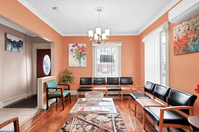 living area featuring a chandelier, a baseboard radiator, wood finished floors, and a wall mounted AC