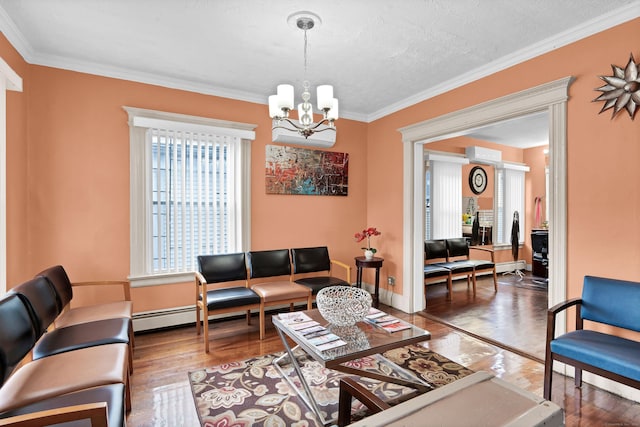 living area with baseboards, ornamental molding, and wood finished floors