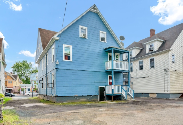 rear view of house with a balcony