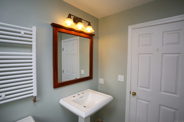 bathroom featuring sink and radiator heating unit