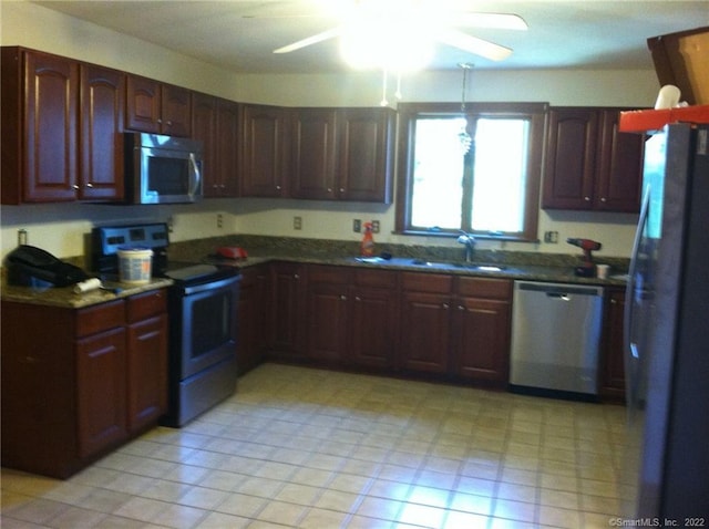 1 Neiderwerfer Rd, East Windsor, CT 06016 - kitchen featuring appliances with stainless steel finishes, dark countertops, and a ceiling fan