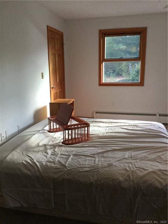 bedroom with a baseboard radiator