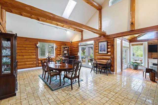 584 Prospect St, Woodstock, CT 06281 - dining room with rustic walls, beam ceiling, high vaulted ceiling, a skylight, and french doors