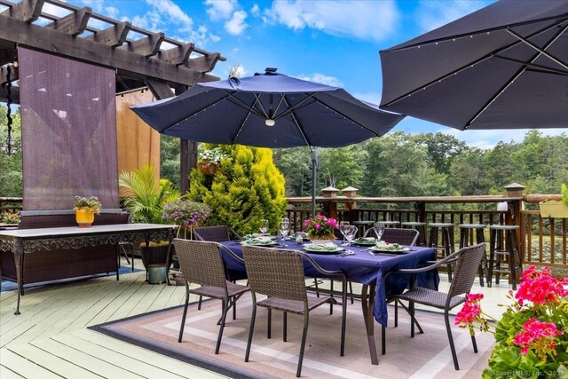 584 Prospect St, Woodstock, CT 06281 - wooden deck featuring outdoor dining area and a pergola