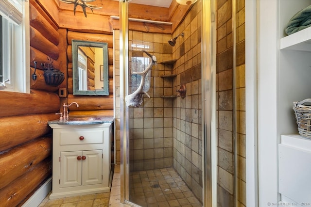 bathroom featuring vanity, log walls, and an enclosed shower