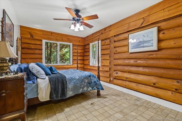 tiled bedroom featuring log walls and ceiling fan