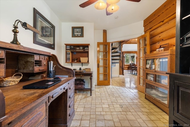 kitchen featuring light tile patterned floors, butcher block counters, and ceiling fan