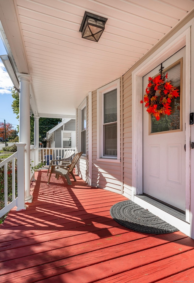 wooden terrace with a porch