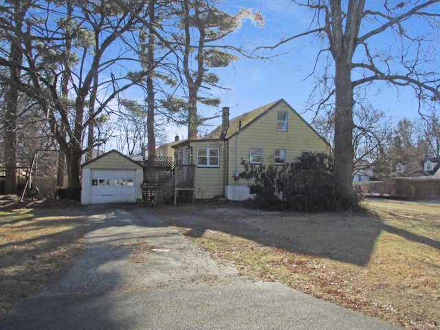 view of side of property with a garage