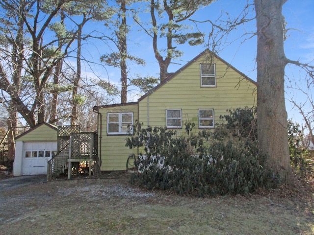 view of side of home featuring a garage