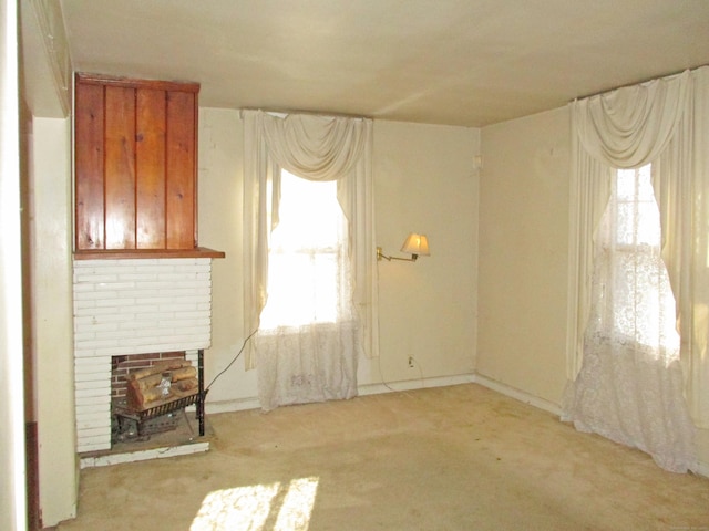 unfurnished living room featuring light colored carpet