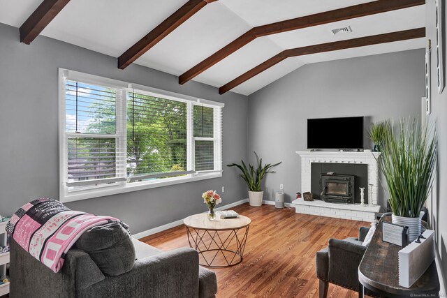 207 Jepson Ln, Meriden, CT 06451 - living room featuring wood finished floors, baseboards, and a brick fireplace