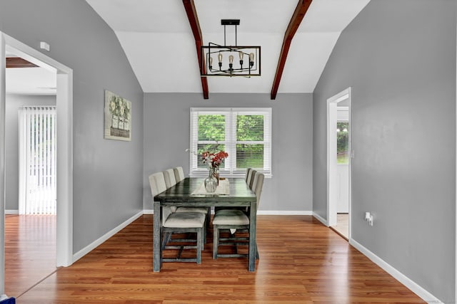 207 Jepson Ln, Meriden, CT 06451 - dining space with a chandelier, wood finished floors, and baseboards