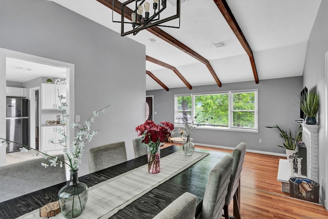 207 Jepson Ln, Meriden, CT 06451 - dining area featuring light wood-type flooring, baseboards, and a chandelier