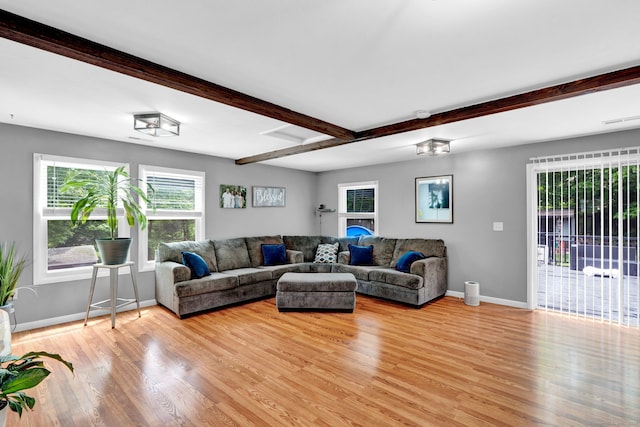 207 Jepson Ln, Meriden, CT 06451 - living area with light wood-style floors, baseboards, and beamed ceiling