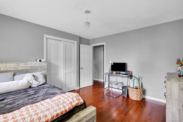 207 Jepson Ln, Meriden, CT 06451 - bedroom featuring wood finished floors, a closet, baseboards, and an office area