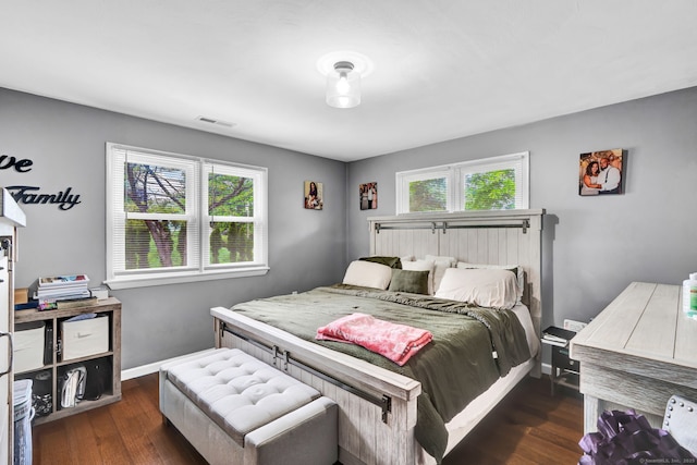 207 Jepson Ln, Meriden, CT 06451 - bedroom with multiple windows, wood finished floors, and baseboards