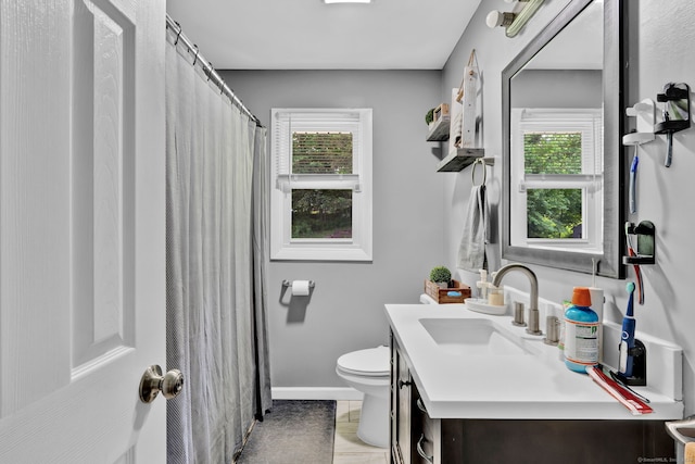 207 Jepson Ln, Meriden, CT 06451 - full bath with plenty of natural light, vanity, toilet, and baseboards