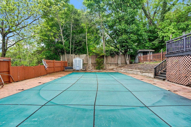 207 Jepson Ln, Meriden, CT 06451 - view of swimming pool featuring a fenced backyard, stairway, a wooden deck, and view of scattered trees