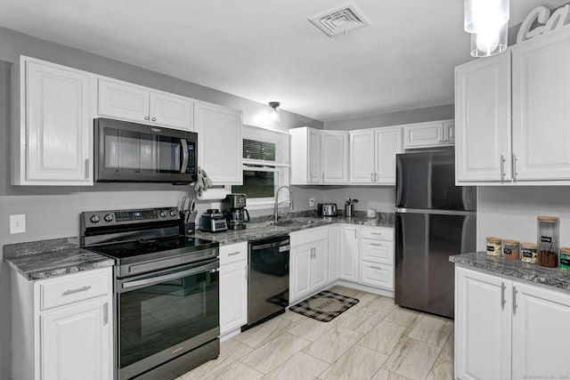 207 Jepson Ln, Meriden, CT 06451 - kitchen with black appliances, a sink, and white cabinets