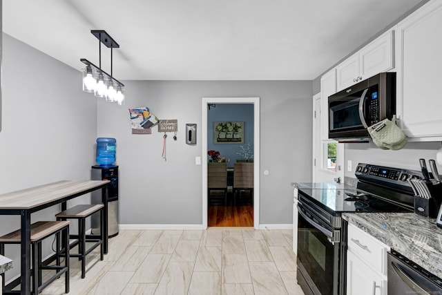 207 Jepson Ln, Meriden, CT 06451 - kitchen with electric stove, dishwasher, white cabinetry, baseboards, and hanging light fixtures