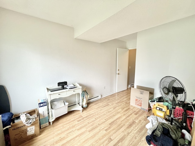 misc room featuring light hardwood / wood-style floors and baseboard heating