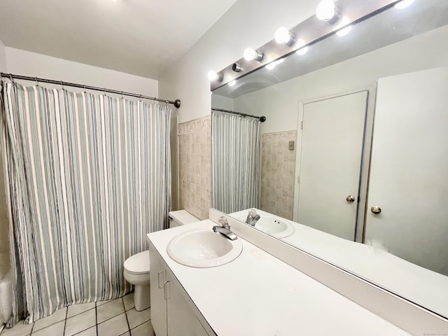 full bathroom featuring shower / tub combo, vanity, tile patterned floors, and toilet