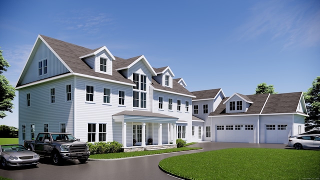 view of front of property featuring a garage and a front lawn