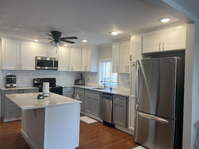 kitchen with appliances with stainless steel finishes and white cabinets