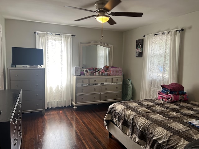 bedroom featuring dark wood-type flooring and ceiling fan