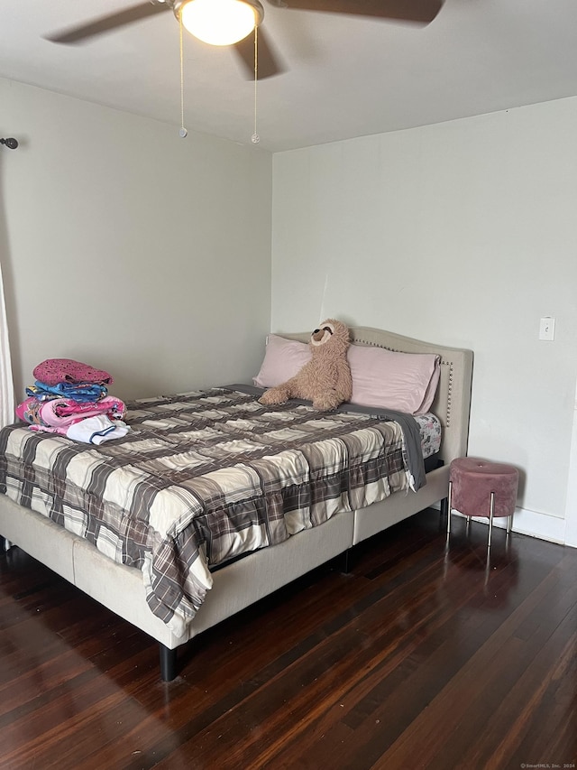 bedroom featuring wood-type flooring and ceiling fan