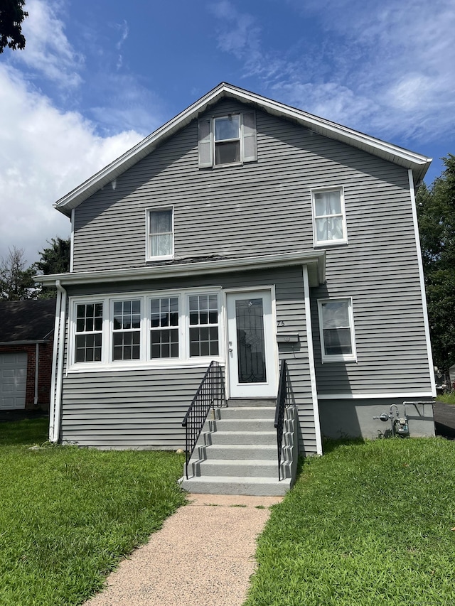 view of front of property with a front lawn