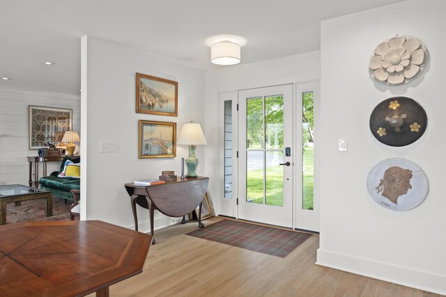 entryway with hardwood / wood-style floors