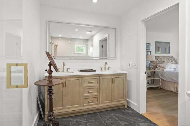 bathroom featuring a shower, vanity, and wood-type flooring