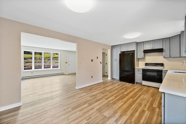 kitchen featuring sink, electric range oven, black refrigerator, a baseboard radiator, and gray cabinets