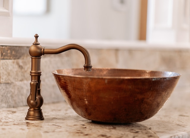 details featuring sink and a bath