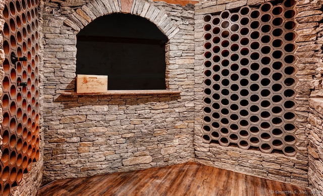 wine area with hardwood / wood-style floors