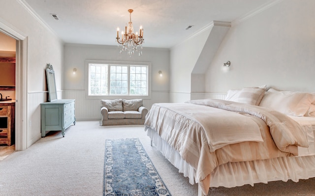 carpeted bedroom featuring a notable chandelier and ornamental molding