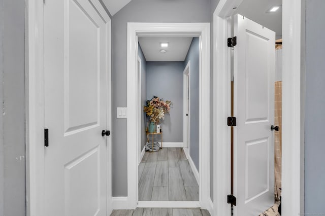 hallway with light wood-type flooring